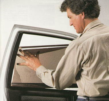 Window-tint-being-installed-on-car-windows